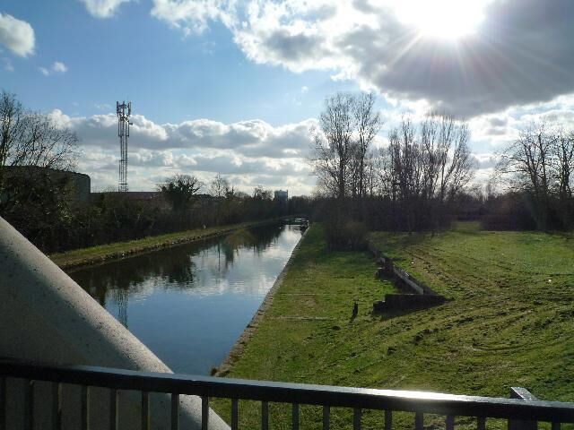 View from the canal bridge located close to the Willowtree Marina The Southall gasometer can be seen in the background.