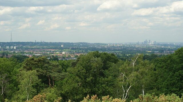 View From Addington Hills (2) To the right of picture are the offices at Canary Wharf, some 9 miles away. Towards the left of picture, the tops of the offices in the City of London can just be seen above the skyline; also 9 miles away. On the extreme left of picture is one of the television transmitters at Crystal Palace, a mere 4 miles away.