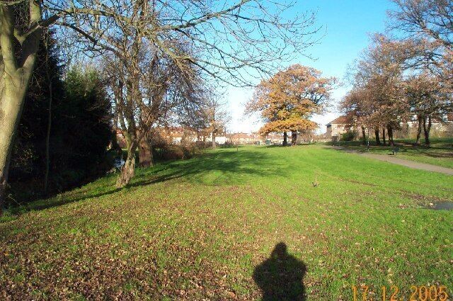 Burnt Oak: Watling Park. Viewed looking northwards with a tributary brook of the Silk Stream flowing in the channel to the left.
