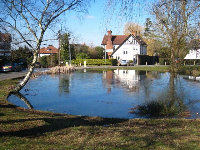 Pond on the north west corner of Uxbridge Common After a cold night, there is still ice on the surface around midday in early March.