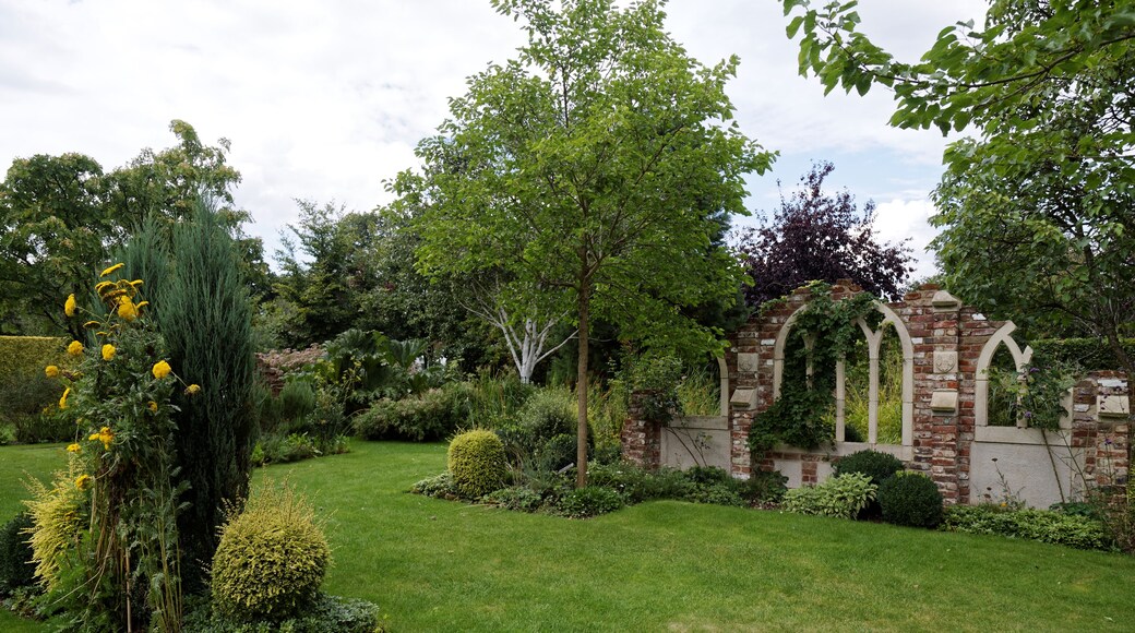 Borders ruins and lawn in the 'Old Manor House Garden' folly at Capel Manor College and Gardens, Bulls Cross, Enfield, London, England. Software: RAW file lens-corrected, optimized and converted to JPEG with DxO OpticsPro 10 Elite, and likely further optimized and/or cropped and/or spun with Adobe Photoshop CS2.