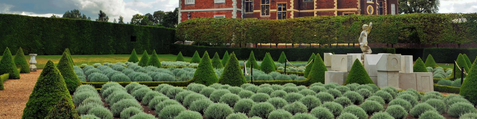 A view of Stuart-era Ham House from across the adjacent gardens, laid out in neat orderly rows.