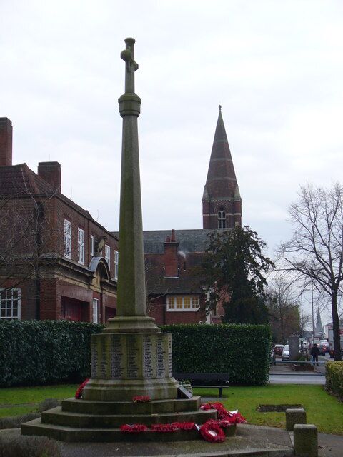 Surbiton War Memorial Set in a memorial garden on the Ewell Road. Beyond are a fire station and church spire.