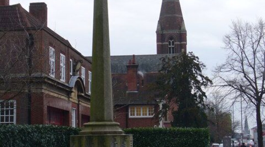 Surbiton War Memorial Set in a memorial garden on the Ewell Road. Beyond are a fire station and church spire.