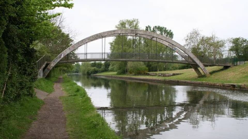 Footbridge opposite parkland, Paddington Arm, Grand Union Canal The modern bowstring footbridge seen from the eastern side.