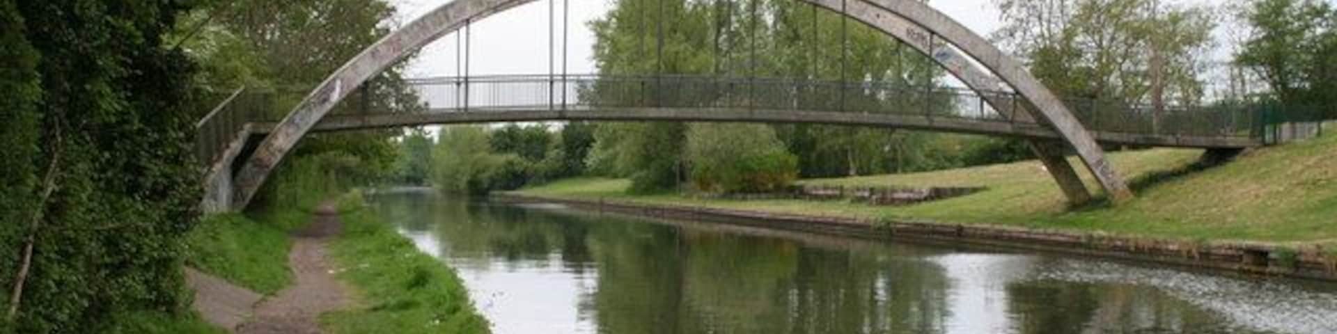 Footbridge opposite parkland, Paddington Arm, Grand Union Canal The modern bowstring footbridge seen from the eastern side.