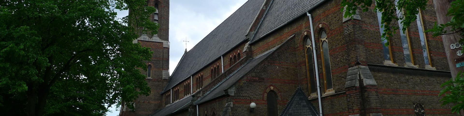 Holy Saviour Church, St Saviours Road, Croydon. Image taken from the East. Both the church and the wall surrounding the churchyard are Grade II listed structures. Croydon, Holy Saviour at the Anglican Diocese of Southwark Church Of St Saviour at English Heritage Wall Enclosing Churchyard Of Church Of St Saviour at English Heritage