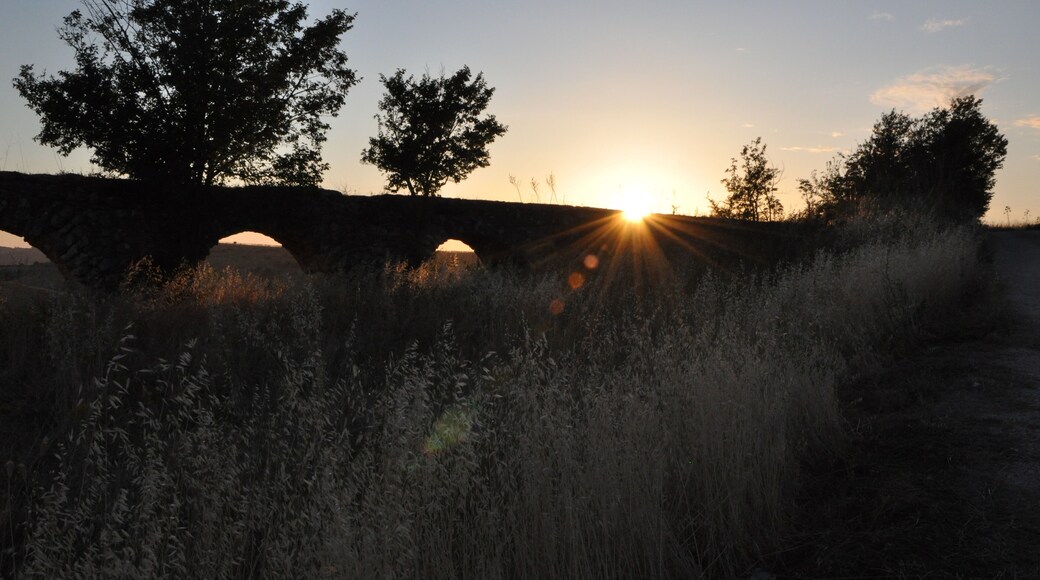 roman aqueduct ruins in monte romano italy at sunset