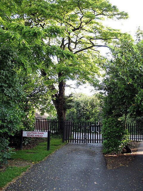 Vehicular Access Gates to allow entry by council garden maintenance vehicles into the parkland beside Dollis Brook. The sign reminds the workers that, beyond the gates, Argyle Road is very busy.
