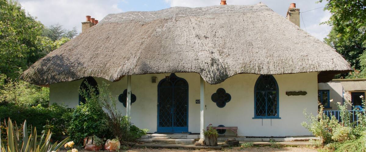 The Hermitage -Hanwell W7 This cottage orné was built by the rector George Henry Glasse in 1809 on the site of a previous house called the Elms. Later it became the head quarters for the Selborne Society. Nikolaus Pevsner describes it thus: “a peach of an early c19 Gothic thatched cottage with two pointed windows, a quatrefoil, and an ogee arched door, all on a minute scale. Inside, an octagonal hall and reception room” (Pevsner, London 3: North West). It is a Grade II Listed Building Behind the cottage lies a spring, which may be the origin behind the 'well' being incorporated into the local place name of Hanwell.