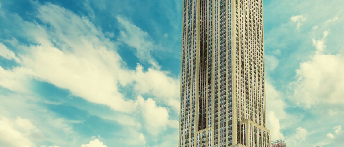 Rooftop cafe overlooking the Empire state building, Manhattan, New York City. Vintage processed.