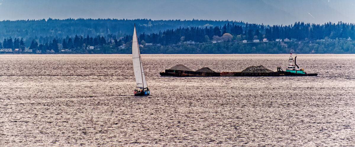 Sailboat and Barge in Channel