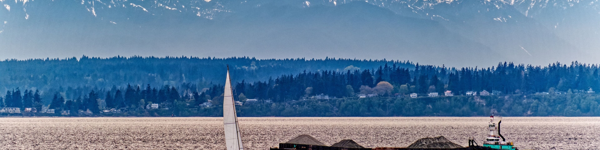 Sailboat and Barge in Channel