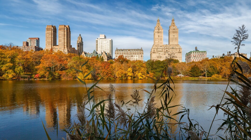 The Lake in Central Park in autumn with reflection of the Upper West Side buildings. Central Park West Historic District, Manhattan, New York City