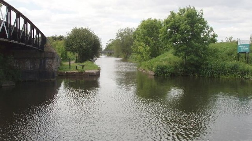 Bridge to Slough Arm, Grand Union Canal. The footbridge gives access from the towpath of the Grand Union Canal to that along its Slough Arm, straight ahead in the photo. See 422229 for a view in January 1977 - mainly different in this spring photo with leaves on the trees looking more pleasant than the earlier one in winter with bare branches.