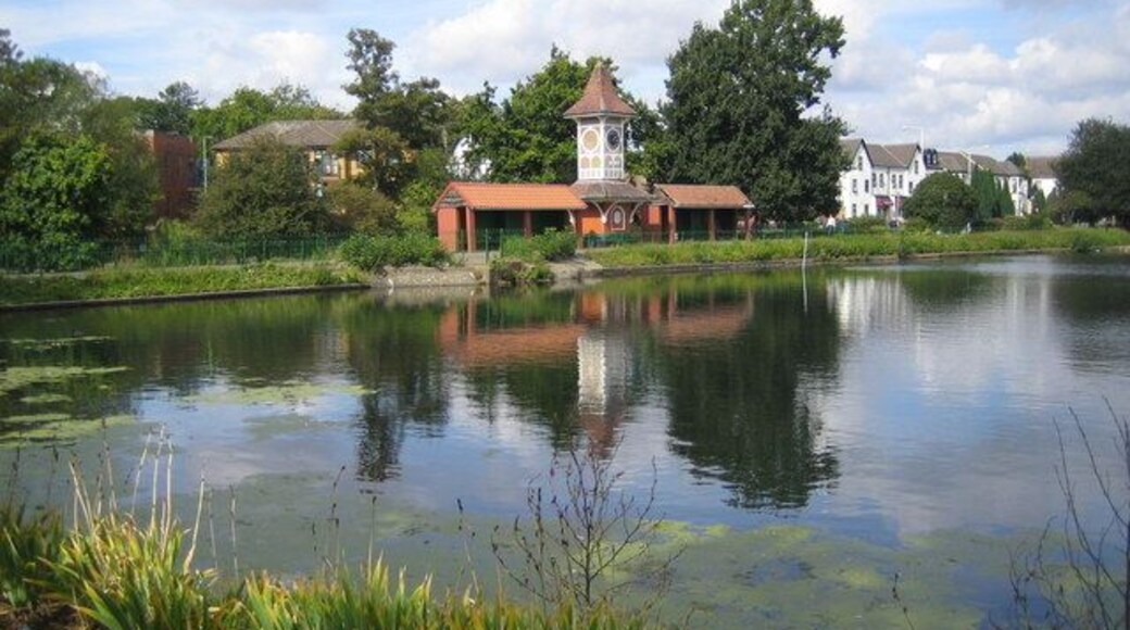 Cranbrook: Valentines Park clock tower This view was taken looking across the boating lake in Valentines Park towards the clock tower, which was built in 1899 on the opening of the park. A plaque on the clock tower commemorates that it was presented by W. P. Griggs Esq. At its opening the park was known as Cranbrook Park, as witnessed by the plaque, but the name was changed in 1907 to register its association with the nearby Valentines Mansion.