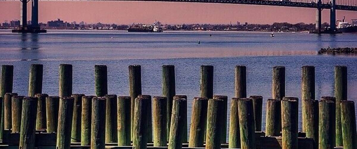 One of the best views and lesser known areas in New York. Sunset behind the Throgs Neck Bridge from Queens, Fort Totten State Park #travel #nyc #sunset