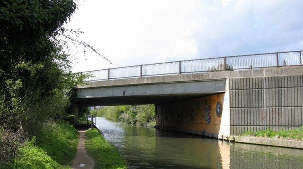 Kensington Road Bridge, Paddington Arm, Grand Union Canal This is the east face of the bridge. The drawings underneath are not casual graffiti, but are murals painted by pupils of a local primary school. The bridge carries Kensington Road, a motor road of local importance connecting Northolt with Southall.