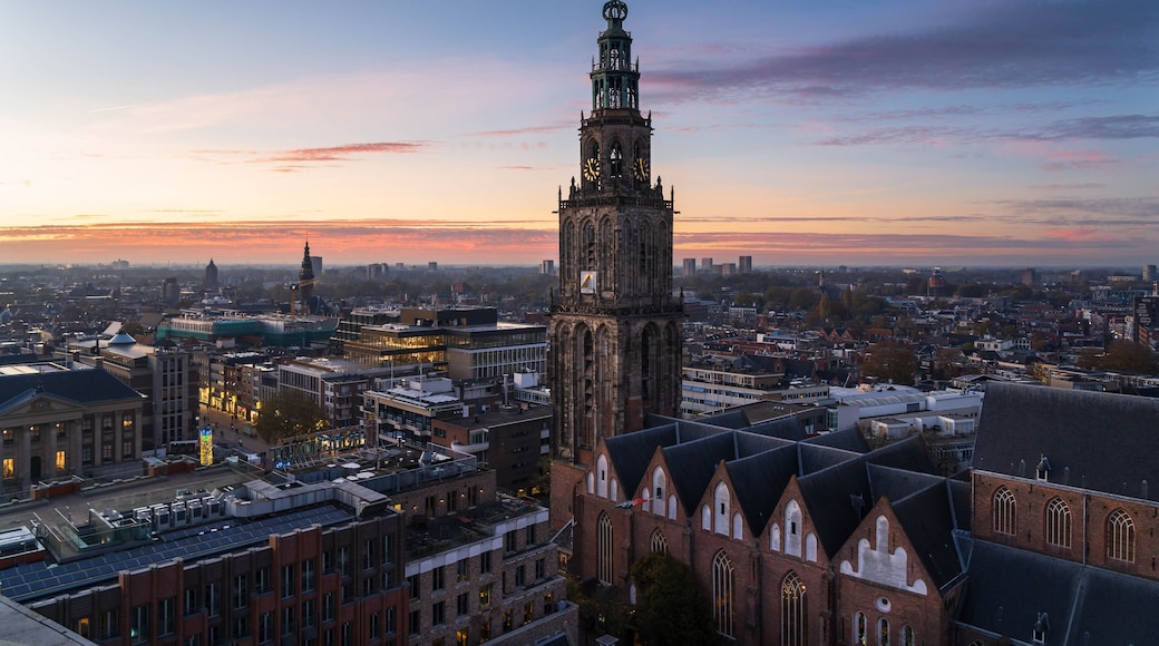 A cityscape with a prominent church tower and surrounding buildings.