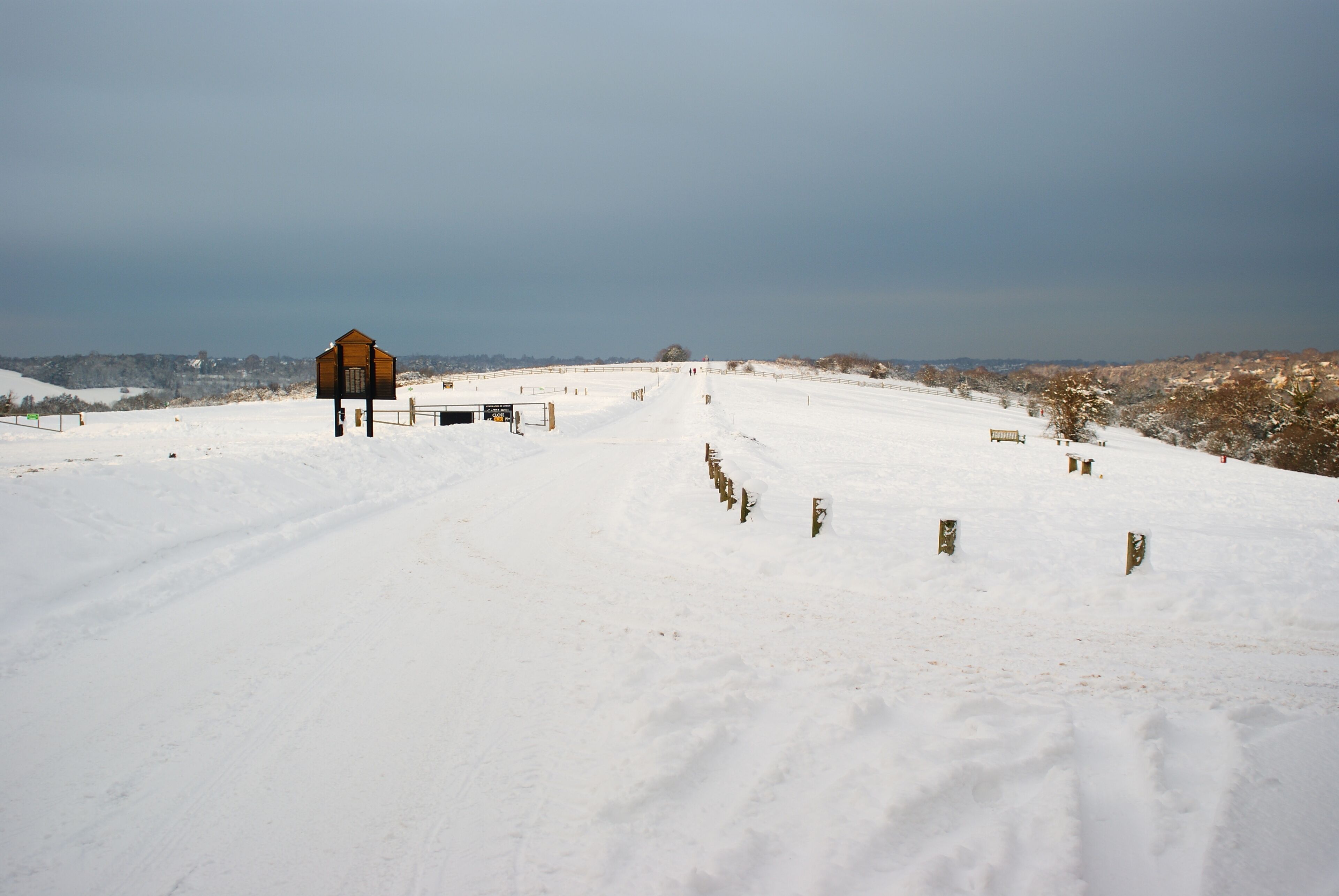 Looking North From Farthing Downs The outline of Farthing Downs, with its covering of snow, can clearly be seen. The car park, popular in summer months, lies out of picture, to the left.