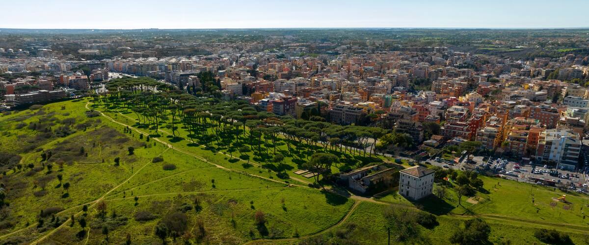 Aerial view on the houses and buildings of Primavalle district in Rome, Italy. In foreground there is Pineto Park.