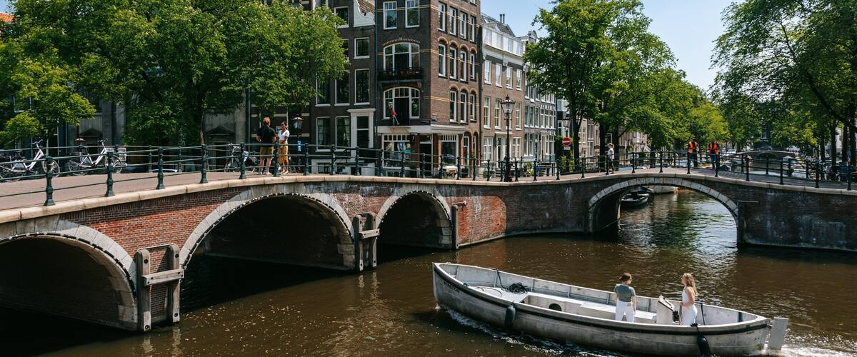 Grachtengordel-Zuid showing a river or creek, a bridge and boating