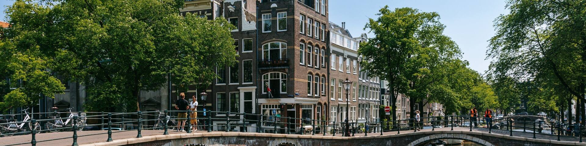 Grachtengordel-Zuid showing a river or creek, a bridge and boating