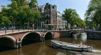 Grachtengordel-Zuid showing a river or creek, a bridge and boating