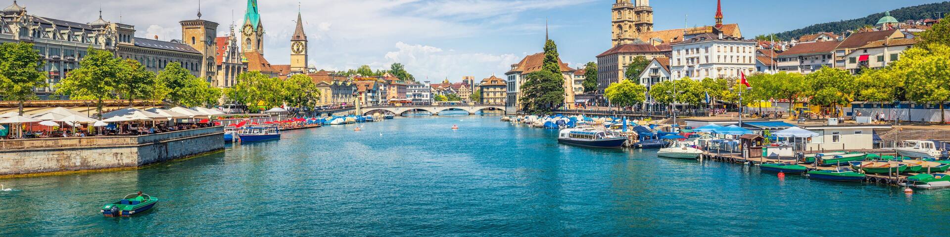 Panoramic view of historic Zurich city center with famous Fraumunster, Grossmunster and St. Peter and river Limmat at Lake Zurich on a sunny day with clouds in summer, Canton of Zurich, Switzerland; Shutterstock ID 462615253; Purchase Order: -