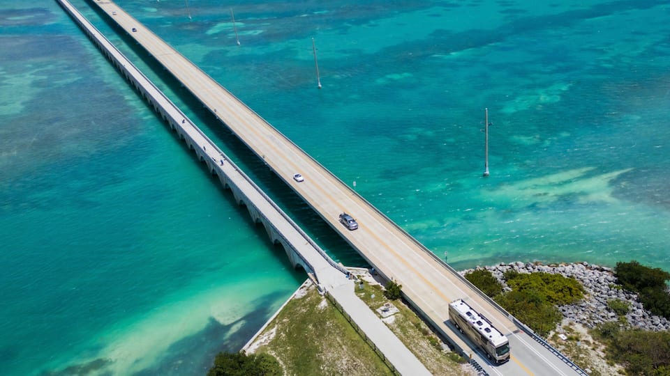 Aerial view of scenic coastal road with turquoise water and bridge, Summerland Key, Florida, United States.