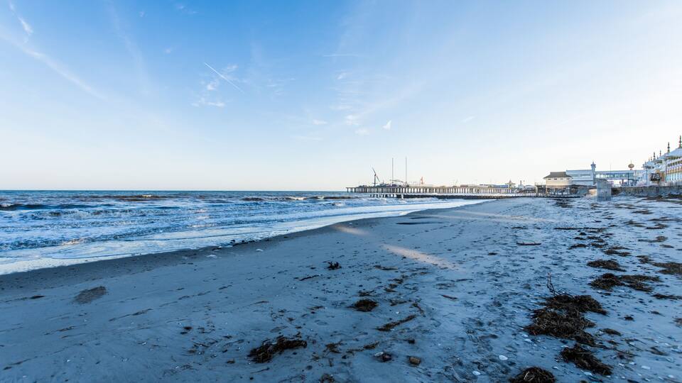 Beach in Atlantic City, New Jersey with boardwalk in background