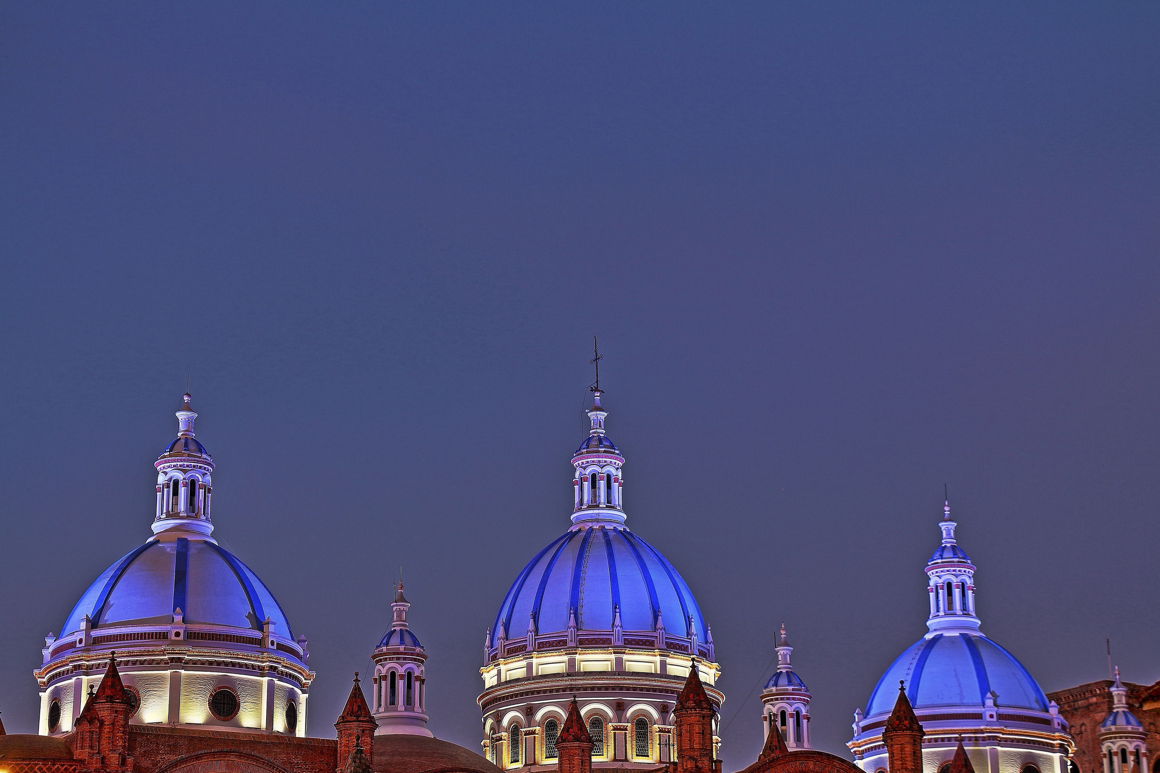 HDR - Cathedral of the Immaculate Conception in Cuenca Ecuador.  View of the three blue domes lit at night.