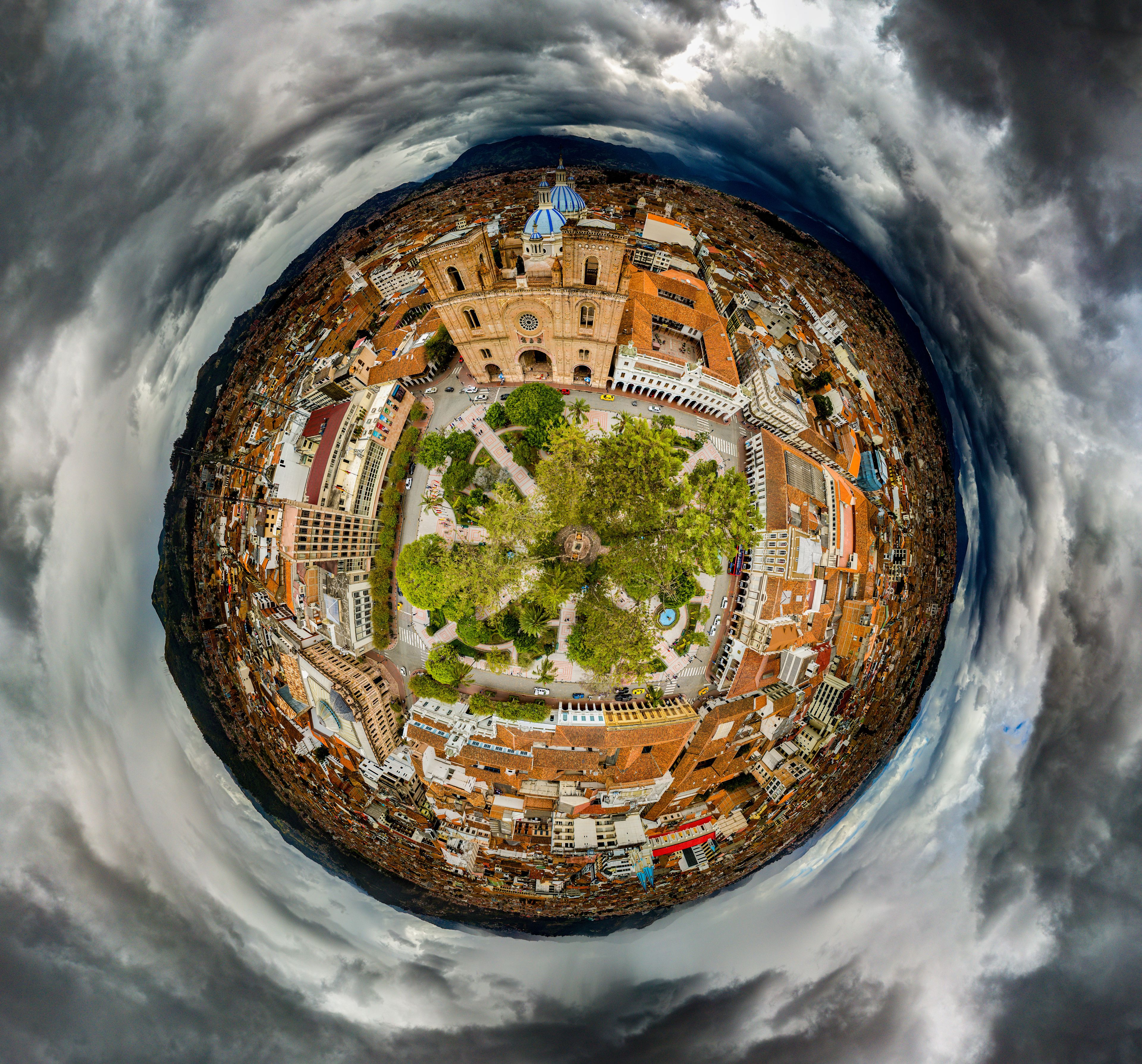 Tiny Planet of Parque Calderon on a stormy day