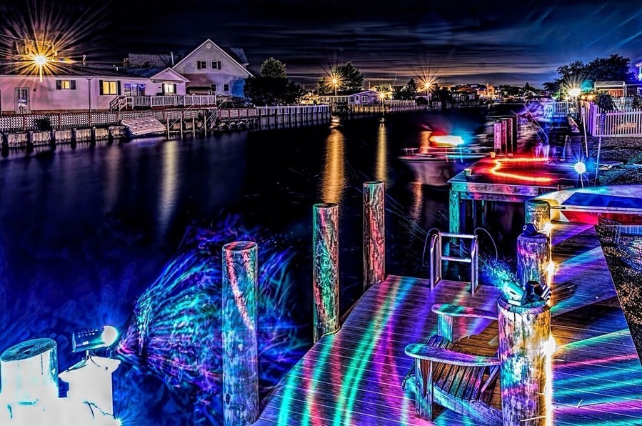 My friends shore house lagoon had a light party. This was a long time exposure the streaks in the air are bubbles.#beach
#waterlust