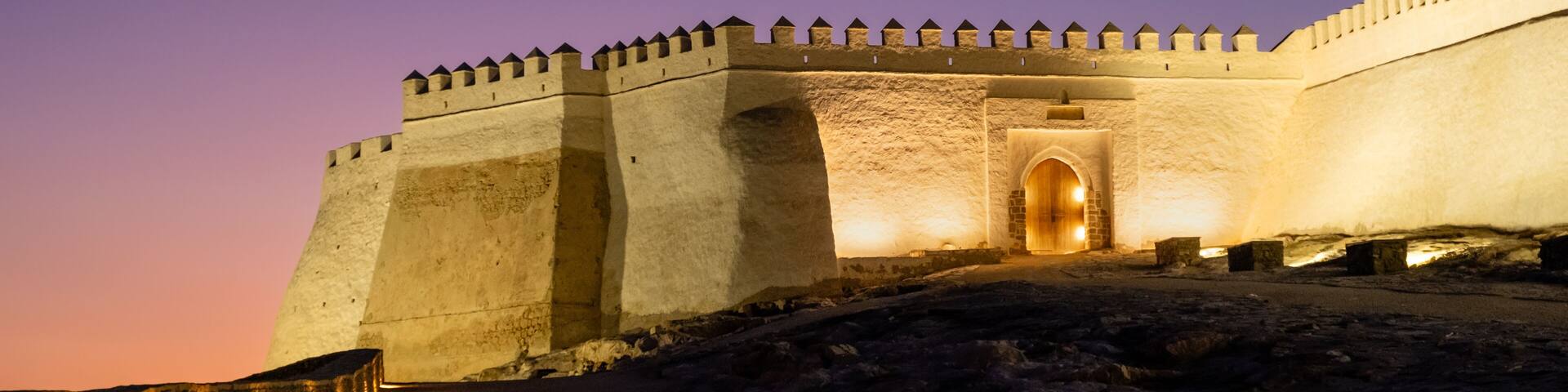 Rests of Agadir Kasbah or Oufla fortress in Agadir city in Morocco at sunset. Fortified quarter ruins on hill with viewpoint over seaside resort