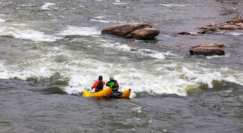Two rafters approaching rapids on the James River in Richmond, Virginia on a bitter cold winter afternoon.