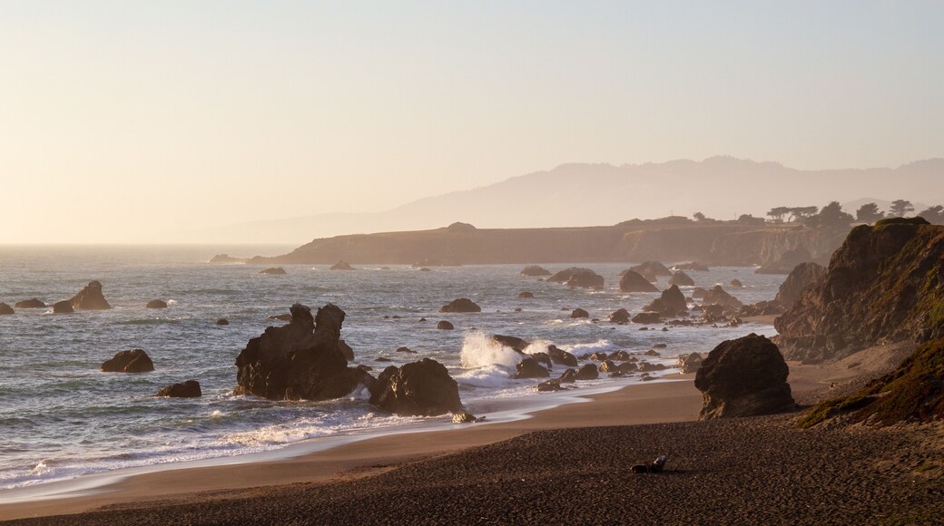 Portuguese beach near Sereno del Mar. Scenic California coastline during sunset with waves crashing onto the rocks