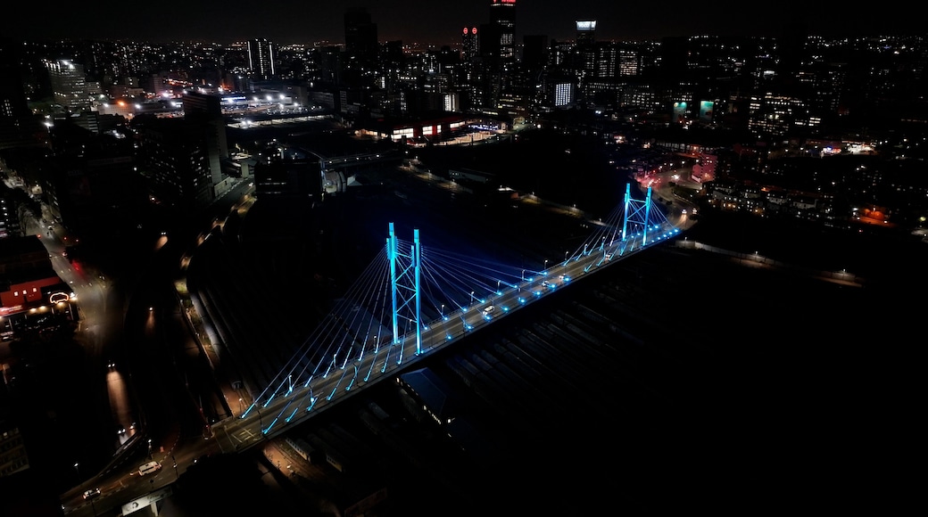 Mandela Bridge At Johannesburg In Gauteng South Africa. Night Scape Town. Illuminated Cable Stayed Bridge. Johannesburg At Gauteng South Africa. Landmark Bridge. Colorful Skyline.