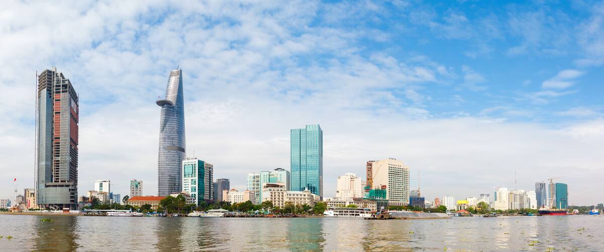 skyscrapers business center in Ho Chi Minh City on Vietnam Saigon on background blue sky. view of the business center from the river