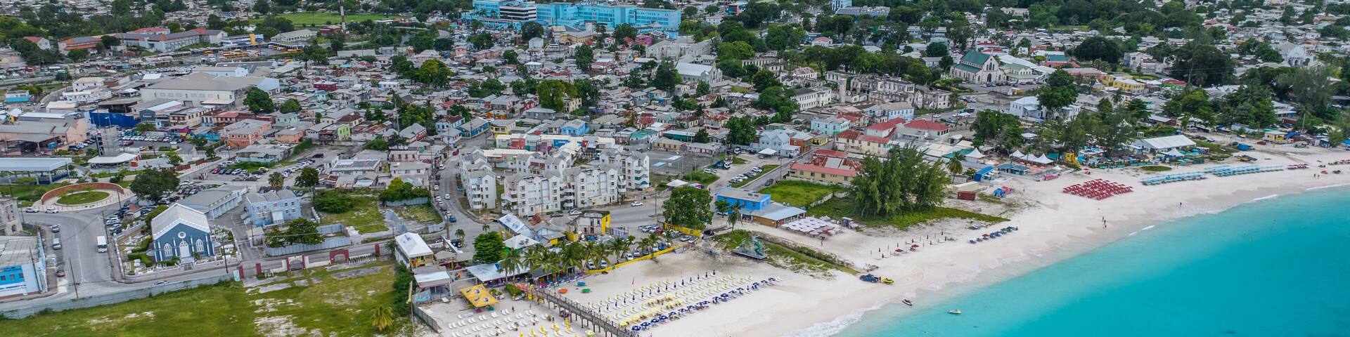 Aerial landscape view of Bay Area of Carlisle Bay at Bridgetown, Capital of Barbados around "Brownes Beach" with white sand beach and amazing turquoise water