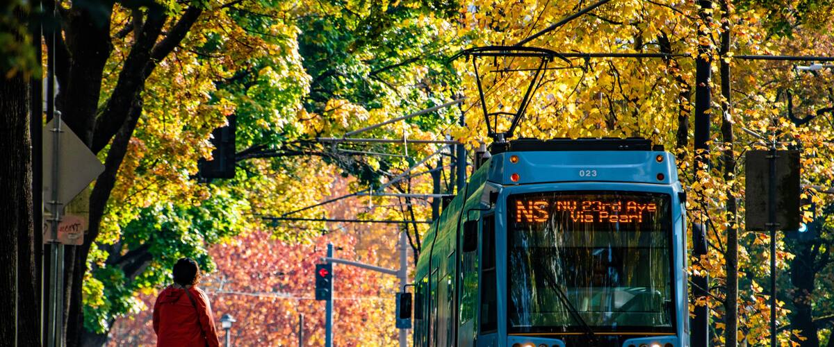 Downtown Portland, OR Shuttle Train Going Down Street With Fall Colors