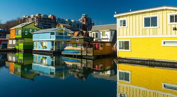 Collorful village of floathomes on bright sunny day, blue sky.