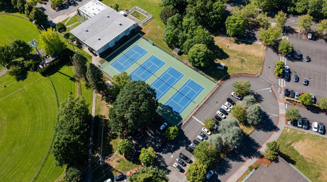 High resolution aerial drone picture of outdoor tennis courts and green fields near a high school in Cedar Mill, Portland, Oregon, captured on a clear summer day