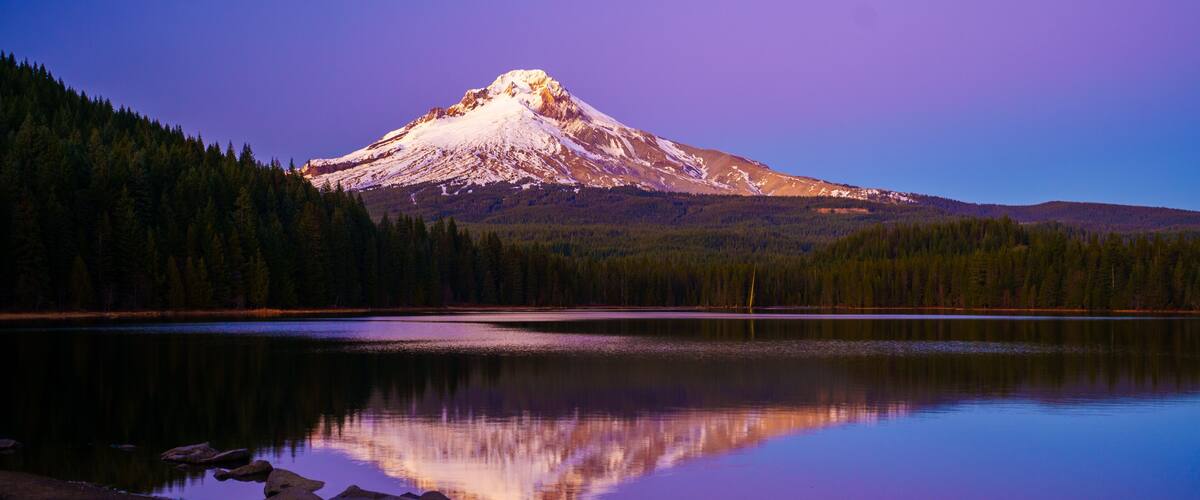 Mount Hood Sunset glow seen on the mountain and reflection on Trillium Lake, Oregon