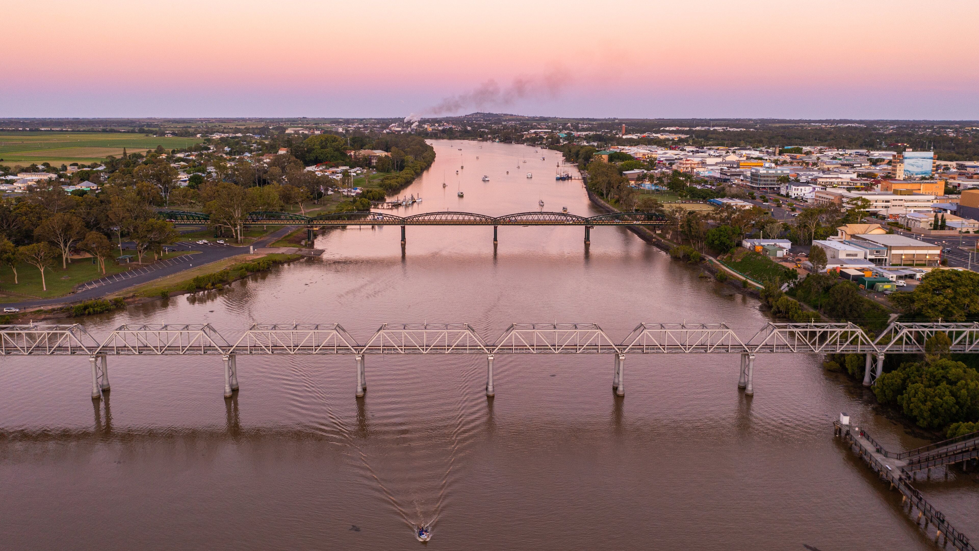Bundaberg Central which includes a sunset, a small town or village and a river or creek