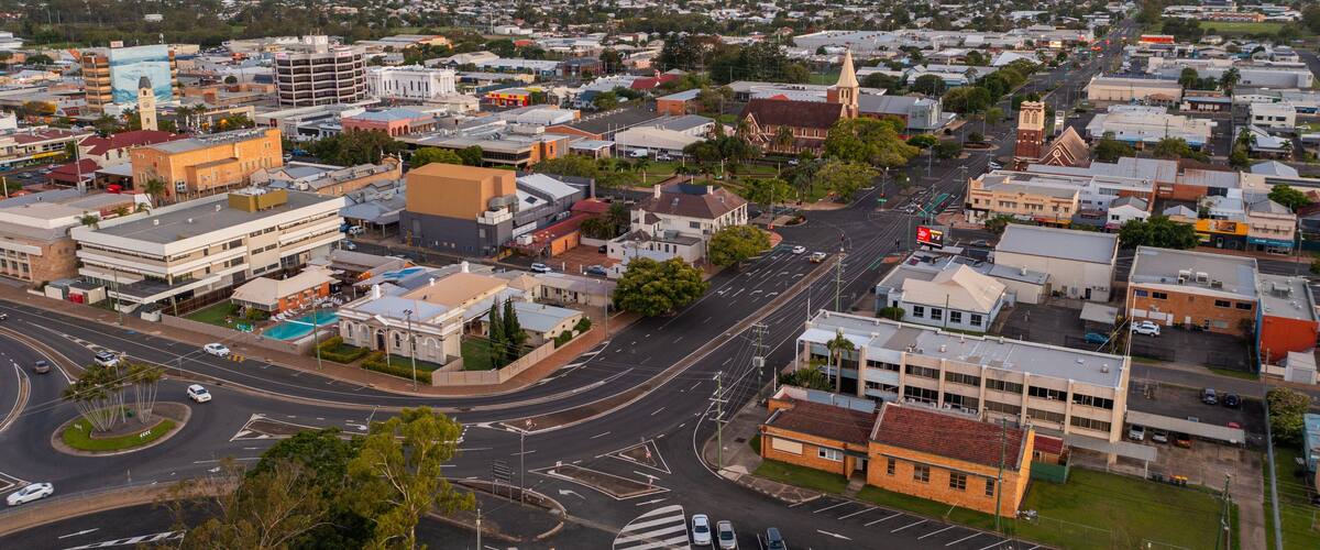 Bundaberg Central featuring a small town or village, landscape views and a sunset