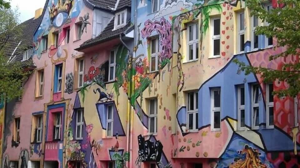 Kiefernstrasse became infamous in the early 1980's for squatting. Nowadays the squatters live in regular tenancies, yet the street remains a colorful display of living counterculture.