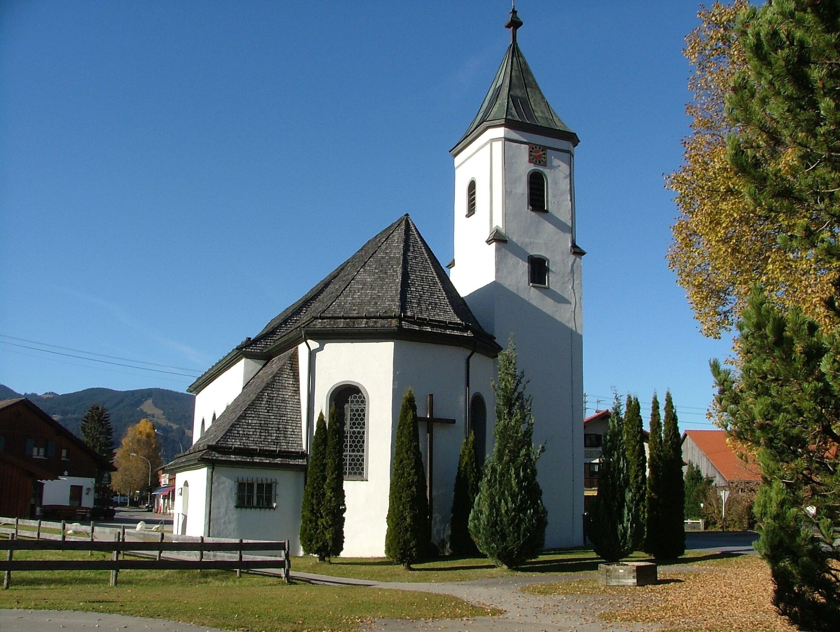 A church with a steeple and a clock tower.