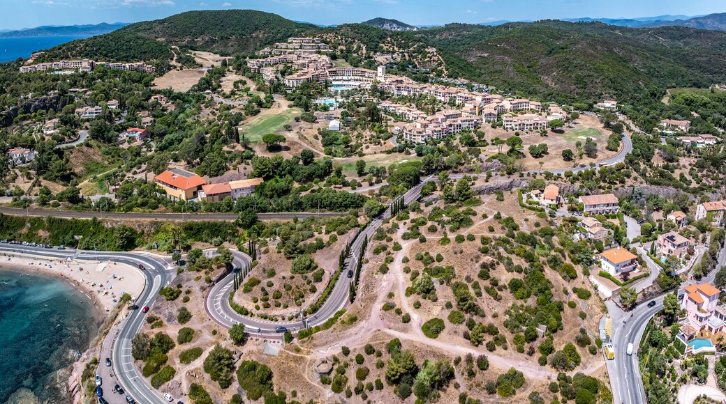 aerial landscape view of area around Village Cap Estérel in Saint-Raphaël, at Agay Bay, French Riviera (Côte d'Azur) with "Plage du Pourrousset" Beaches and wooded hilly landscape in background