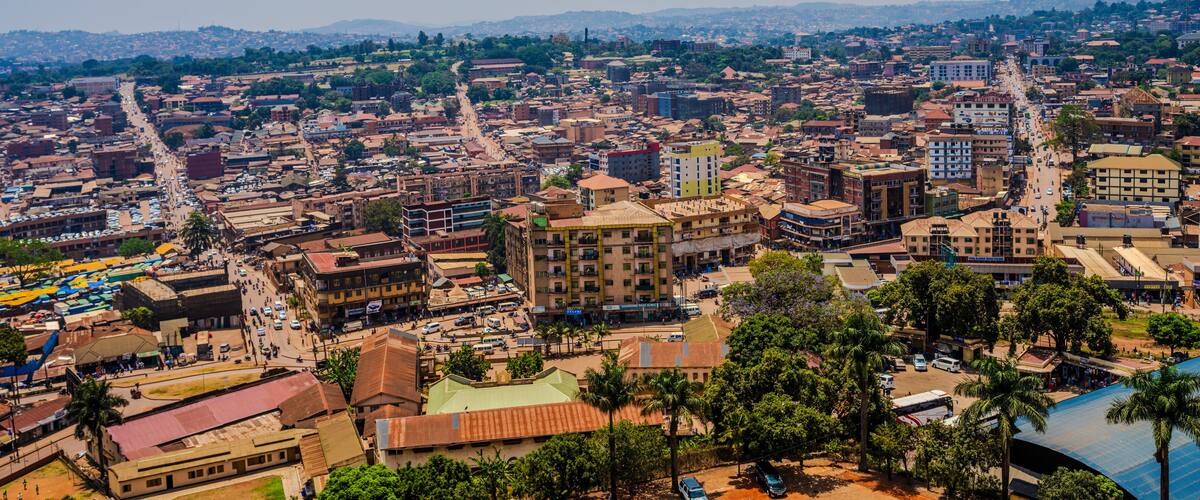 Elevated cityscape view over central Kampala with roads and low-rise buildings
